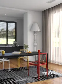 Modern dining area with black table colorful chairs grey rug tall white lamp and window