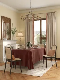 Cozy dining area with red tablecloth woven chairs mirror above fireplace and a ceiling light