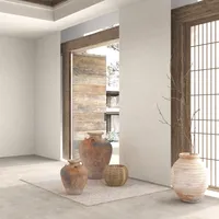 Minimalist room corner featuring three clay pots on rug wooden door and large window screen
