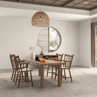 Zen dining area with wooden table chairs woven ceiling light and a circular wall window