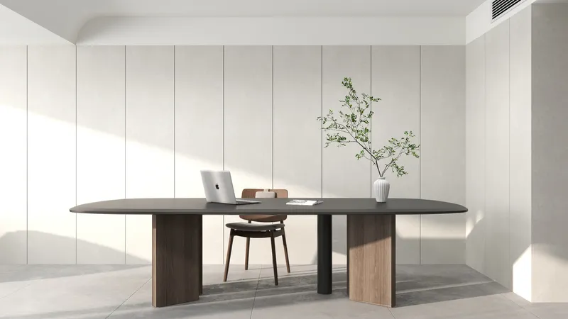 Modern minimalist home office with black desk, wood chair, laptop, green plant, and wall panels