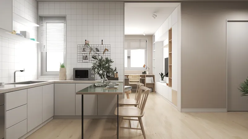 Modern kitchen with white tiles, dining table, two chairs, and view into living room area