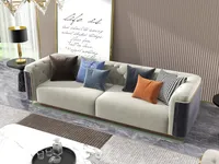 Beige sofa with colorful pillows against a striped wall panel in a modern living room