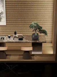 Zen tea room with wooden wall panel a long table bonsai tree and two stools