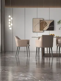 Modern dining room view showing beige chairs, glass table, marble floor, and wall art decoration
