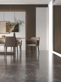 Dining area with wood wall panel art pieces brown chairs and polished dark stone floor