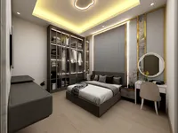 Elegant bedroom with grey bed glass wardrobe round mirror white dressing table and ceiling light