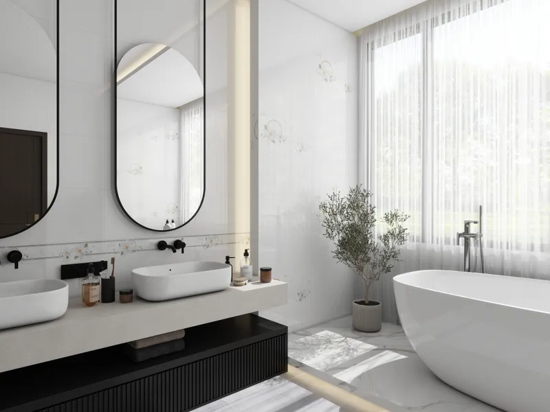 White bathroom featuring double oval mirrors, white sinks, a white bathtub, and green potted plants