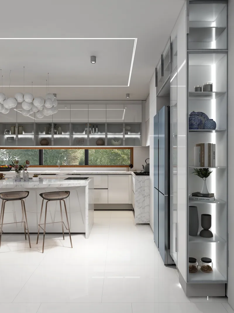 White modern kitchen showing marble island with stools and glass display cabinets beside blue fridge