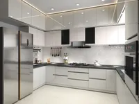 Modern white kitchen with black countertops silver fridge stove oven and white glossy wall cabinets