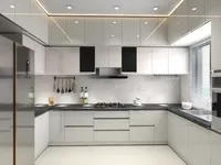 Modern white kitchen layout design with black countertops gas stove sink refrigerator and upper cabinets