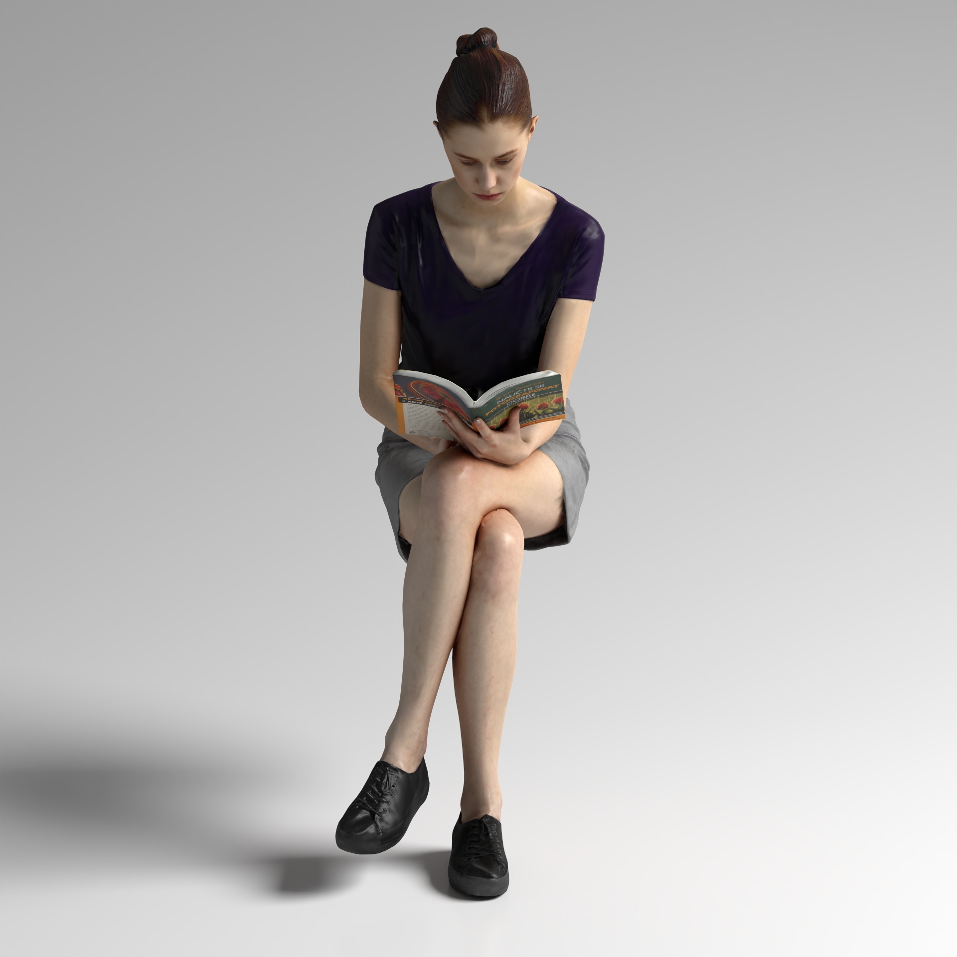 A woman sitting and reading