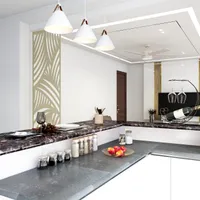Kitchen counter showing white ceiling lights spice jars fruit bowl and decorative white wall panel