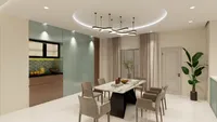 Modern dining room with marble table and grey chairs near green cabinets and light fixture