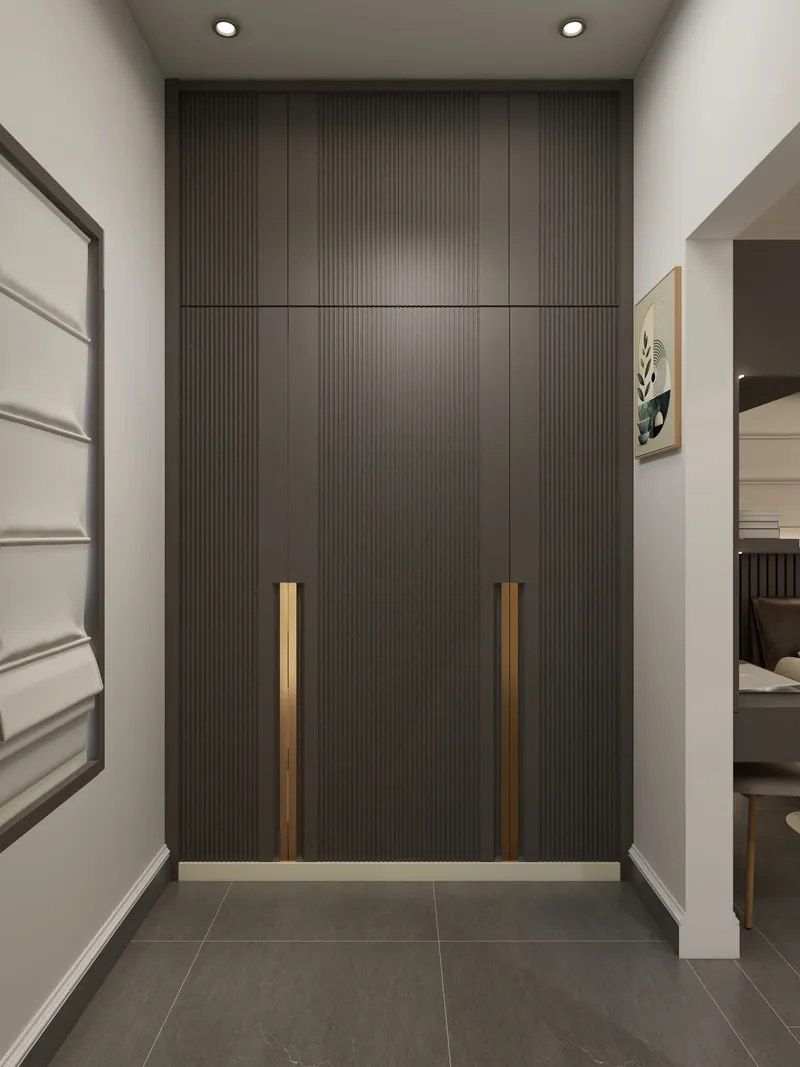 Modern hallway with dark grey tall cabinet gold handles grey tiled floor and ceiling lights