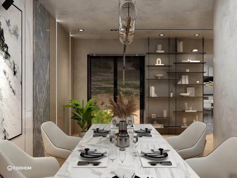 Modern dining room featuring marble table, white chairs, ceiling light, bookshelf, green plant and art