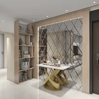 Interior design drawing of entryway showing gold console table diamond wall mirror and wooden bookshelf