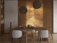 Wooden dining table with white chairs, round ceiling lights, wood slatted wall, and gold mural