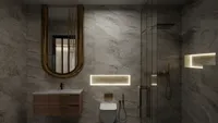 Luxury bathroom with marble walls gold mirror wood cabinet white toilet and glass shower door
