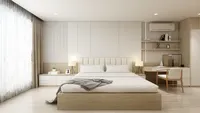 Modern bedroom with wood bed white pillows grey blanket desk chair shelves and side lamps