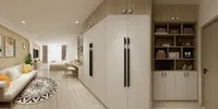 Modern studio apartment with large white wardrobe wooden shelves white sofa and bed in background