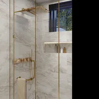 Modern glass shower with a golden shower head marble tile walls and a small window