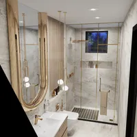 Modern marble bathroom with gold frame mirror white sink white toilet and glass shower area