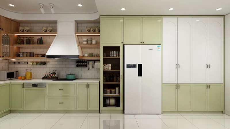 Green and white kitchen cabinets with large white fridge wooden shelves range hood and tiles