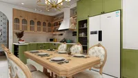 Wooden dining table with plates wine glasses chairs ceiling light and green kitchen in back