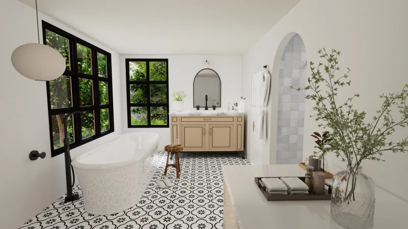 Bright bathroom with white bathtub wooden cabinet patterned floor tiles and large windows with greenery