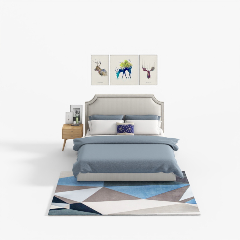 Modern beige upholstered bed with blue bedding and geometric rug on white background