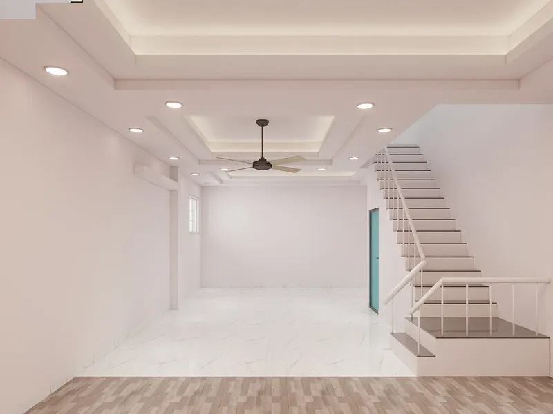 Empty living room with white walls marble floor ceiling fan and stairs to second floor