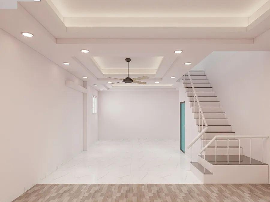 Empty living room with white walls marble floor ceiling fan and stairs to second floor