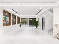 Bright white modern hallway with marble floors green plants glass doors and grey stone stairs