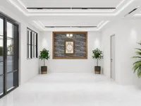 Minimalist room featuring grey stone wall panel framed art two potted plants and glass door