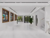 Spacious white marble hall with ceiling lights framed wall art indoor plants stairs and lamp
