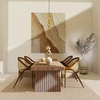 Modern dining area with wood table woven chairs gold ceiling light and large textured wall art
