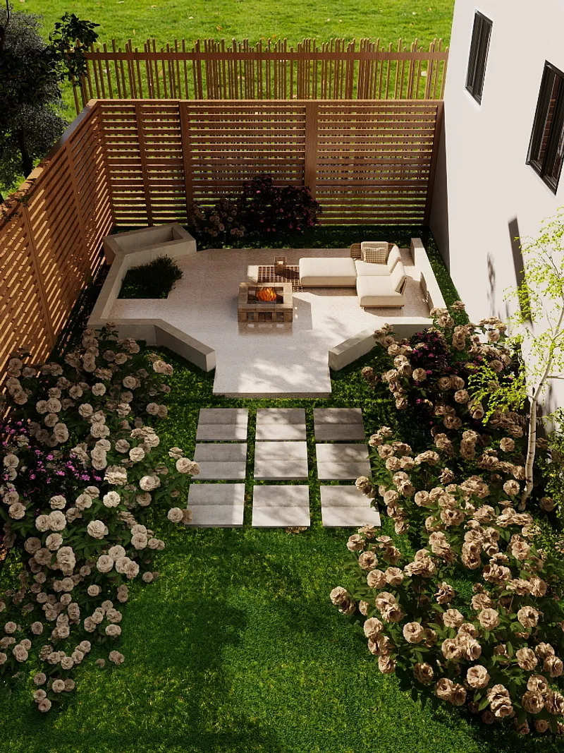 Modern backyard garden with stone patio, cream sofa, fire pit, wooden fence, flowers, and lawn