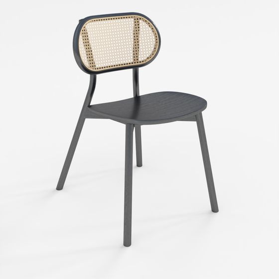 Modern black wooden dining chair with rattan backrest on grey background
