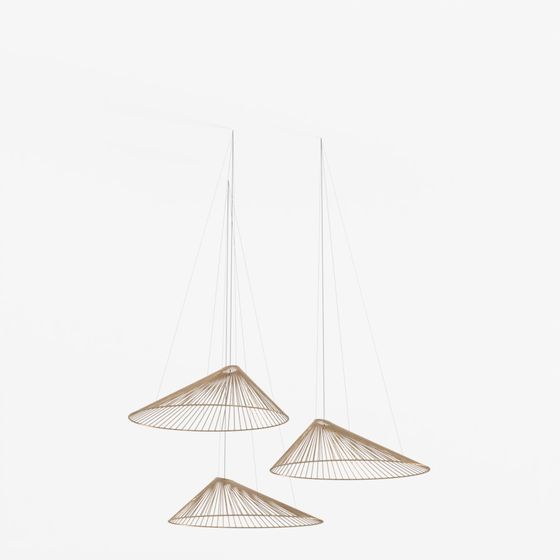 Set of three gold wire cone pendant ceiling lights with thin cables on white background