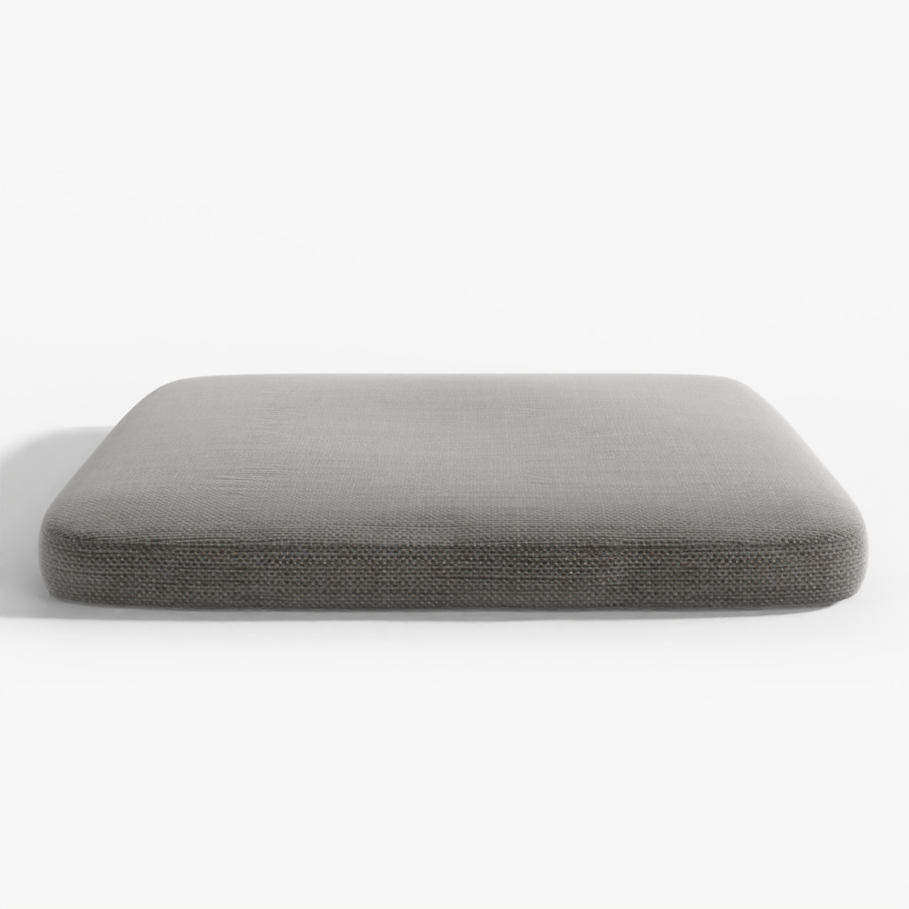 Square dark grey fabric cushion with textured surface and rounded corners on grey background
